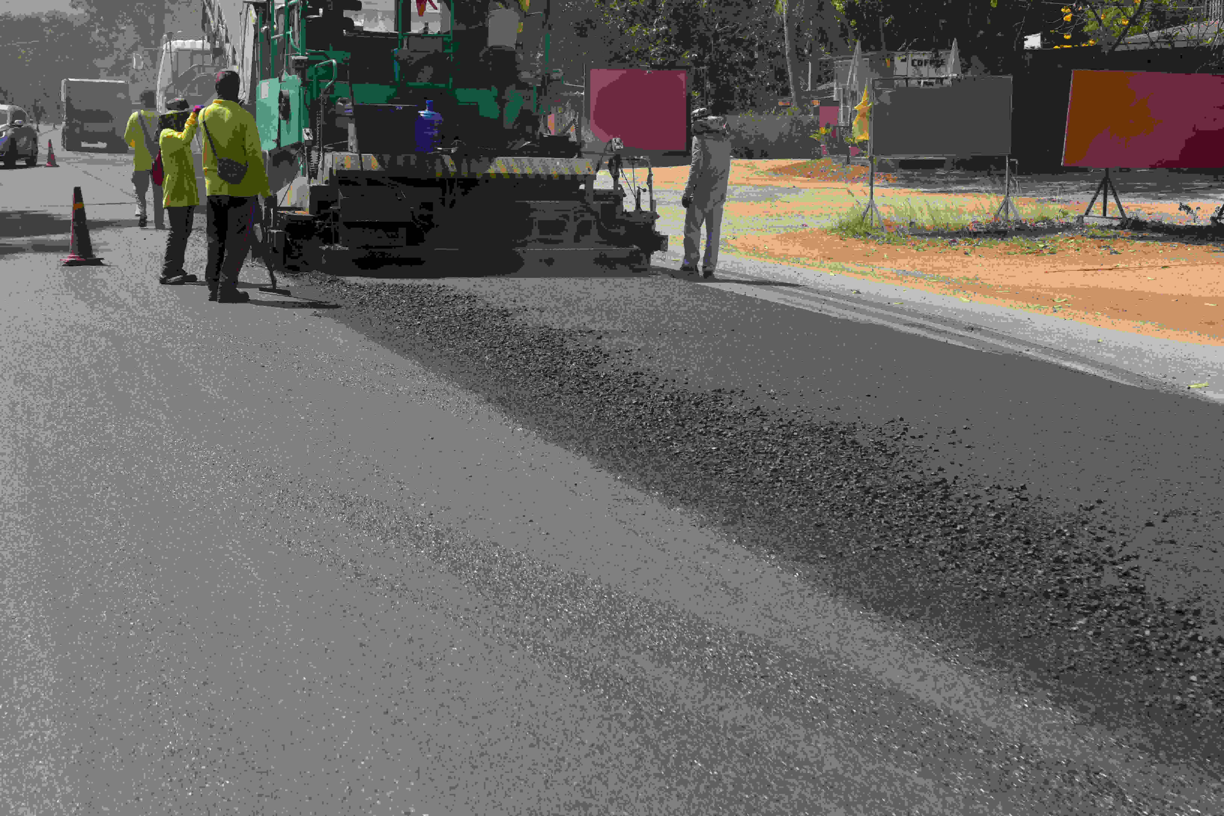 Asphalt paving machinery applying smooth, durable pavement in Dallas