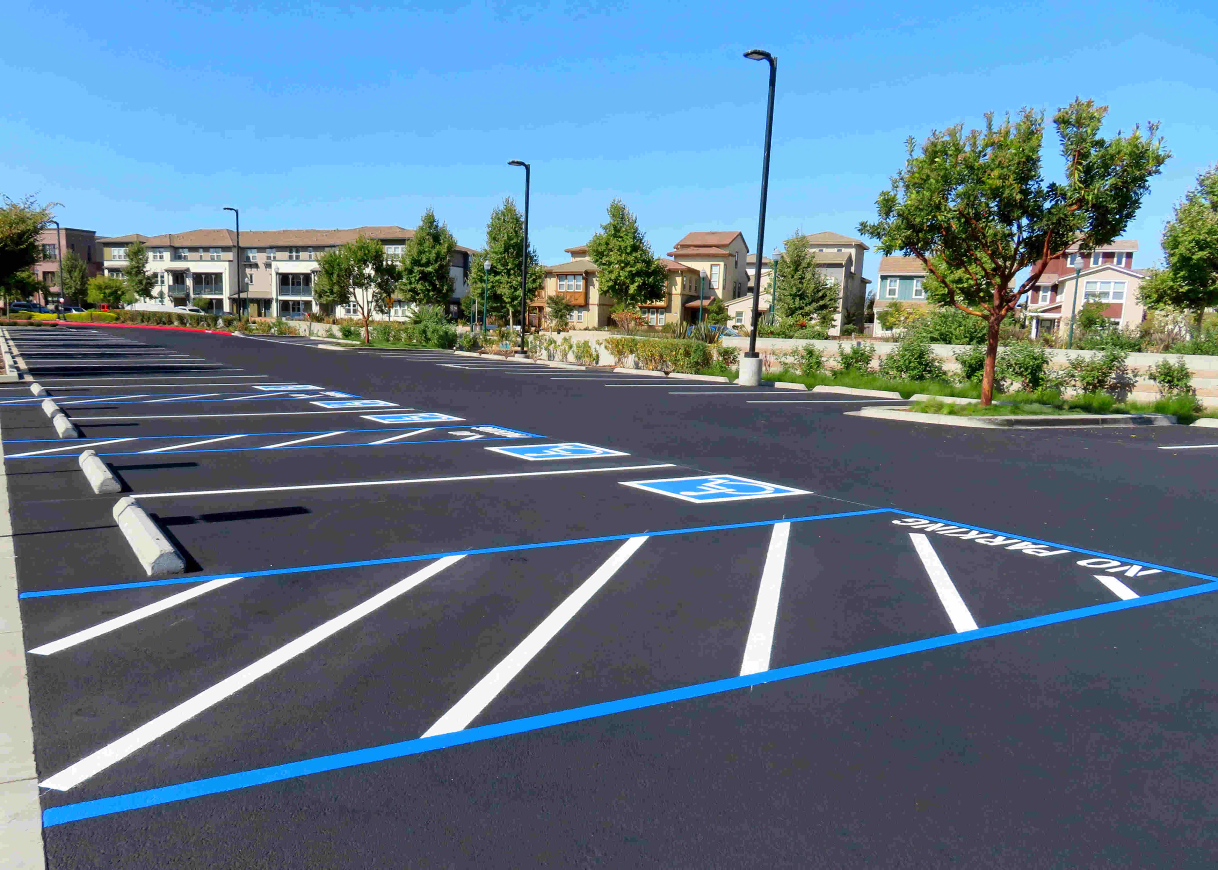 Freshly resurfaced and repainted handicap parking space showcasing high-quality asphalt paving in Dunwoody