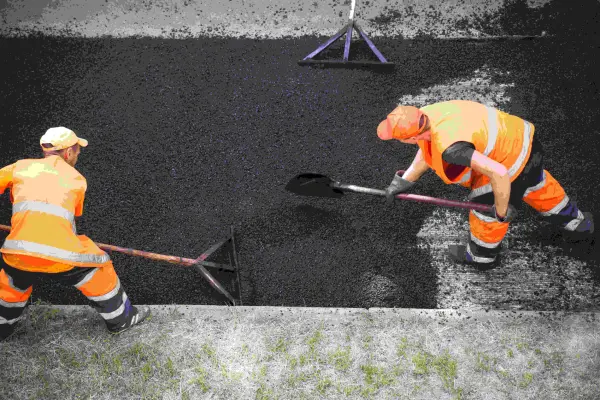 Fresh asphalt being applied during professional asphalt resurfacing in North Georgia.